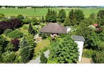 HORN IMMOBILIEN + Einfamilienhaus im Bungalowstil mit parkähnlichem Grundst. 5 km bis Neubrandenburg - Einfamilienhaus Burg Stargard | Angebot:27013653